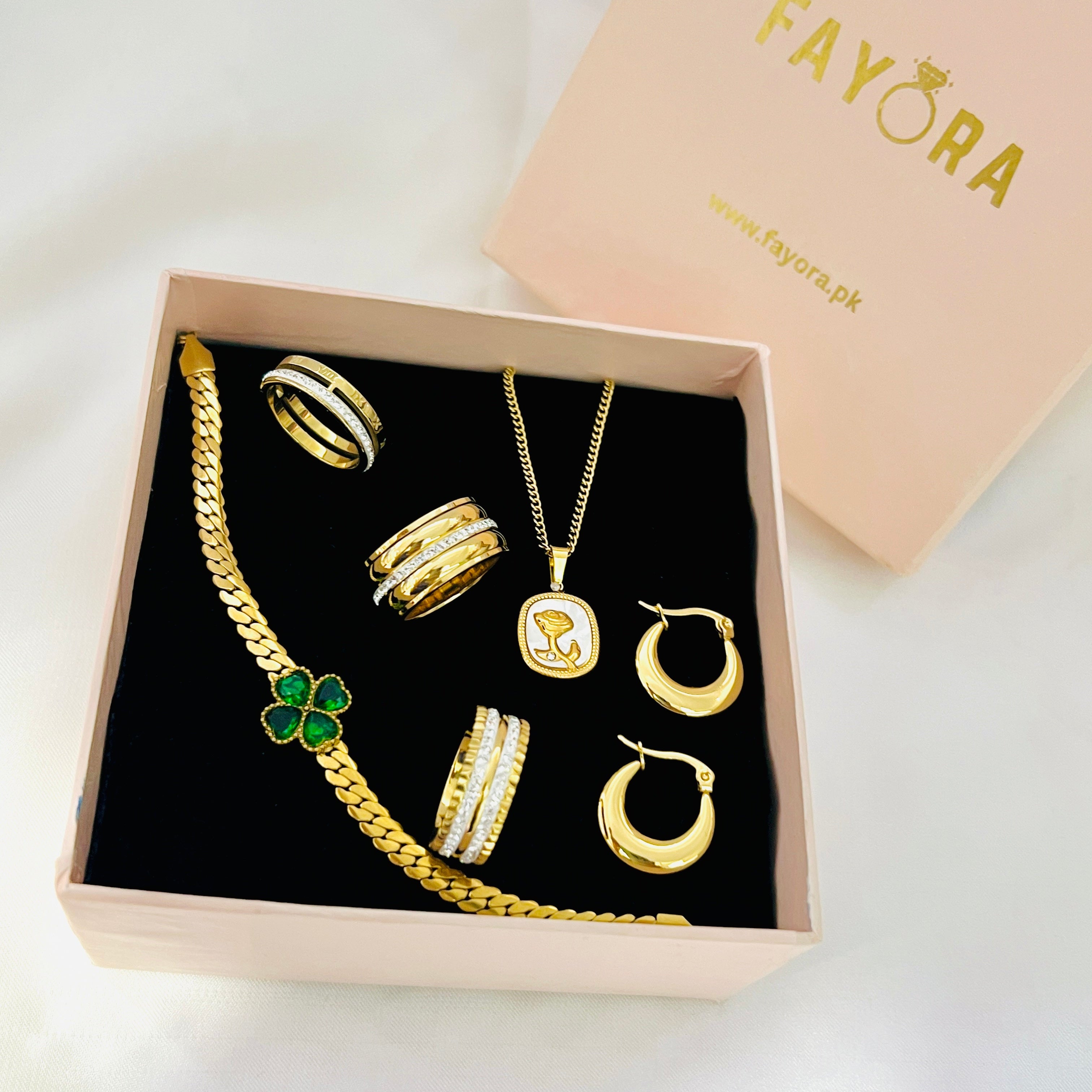 jewelry set including a bracelet, rings, and necklaces in a Fayora box.
